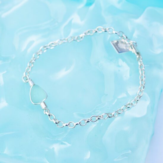 Handmade sterling silver bracelet featuring smooth Cornish sea glass, softly frosted by the ocean and set in a delicate chain.